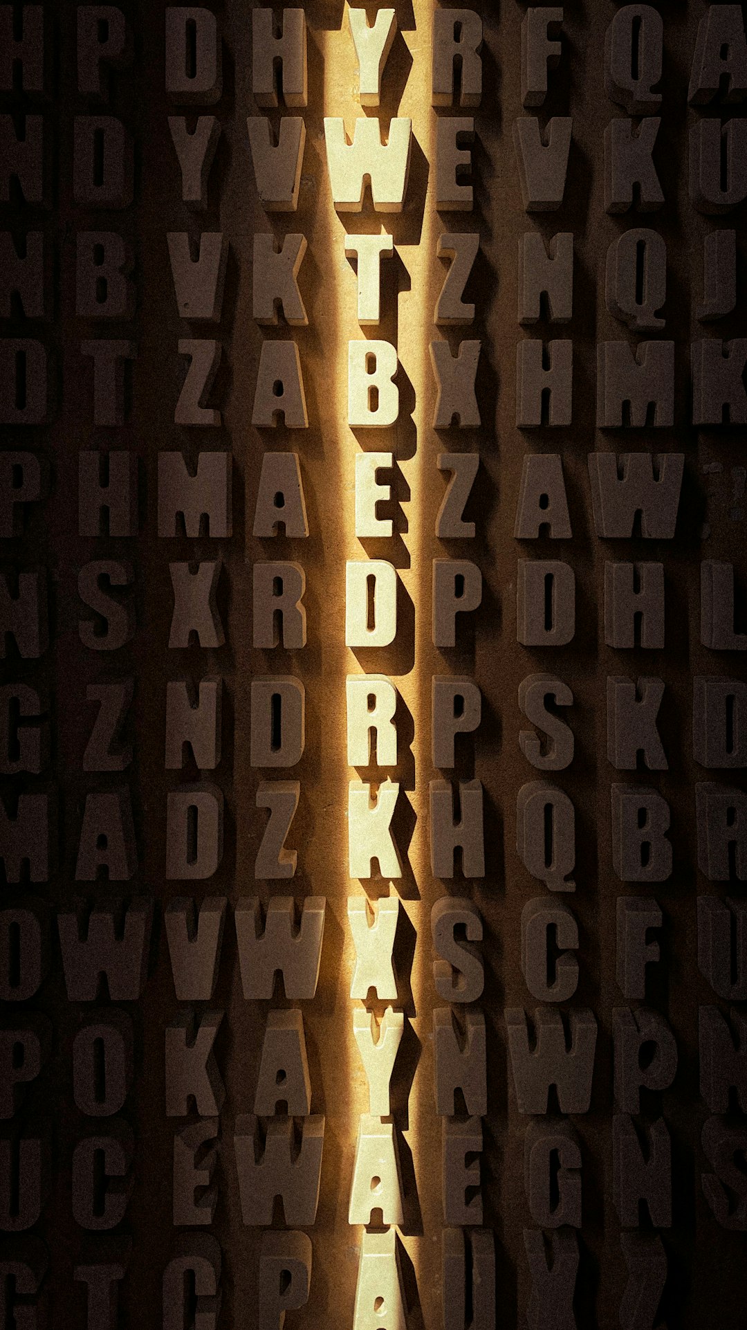 a-close-up-of-the-letters-of-a-wall-qtuczvinrlg